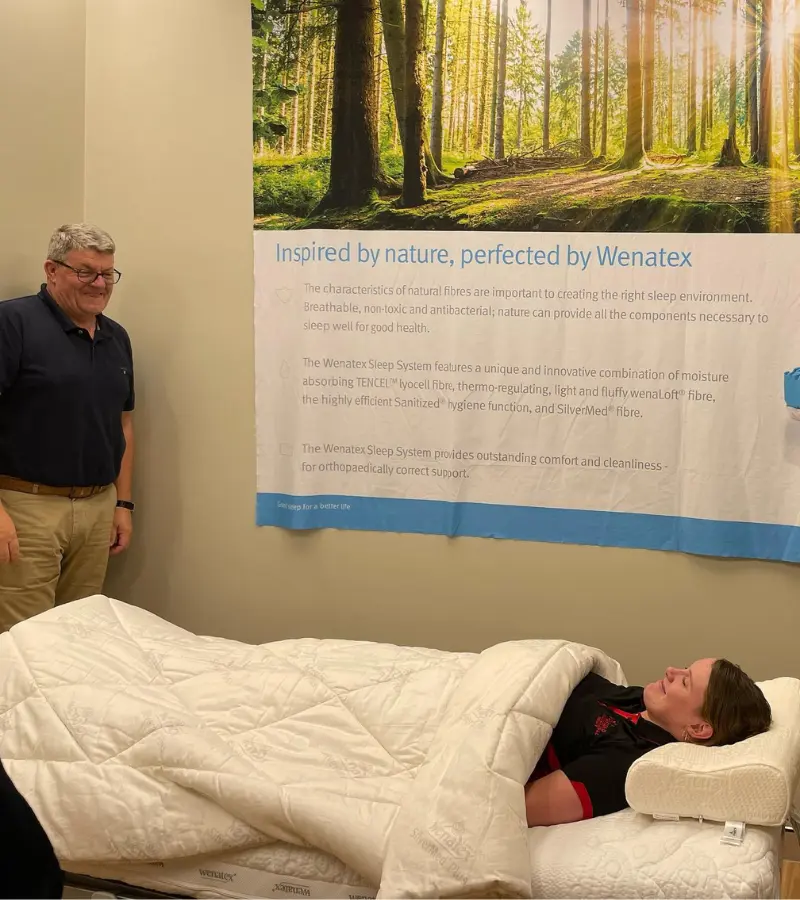 Astrad occupational therapist with women lying on bed