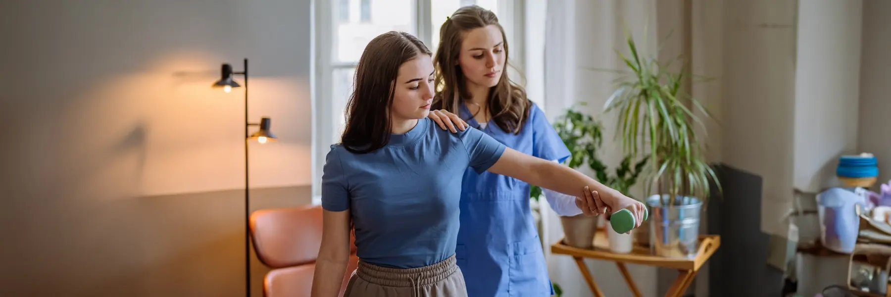 Astrad Team Member Giving Occupational Therapy to Young Girl