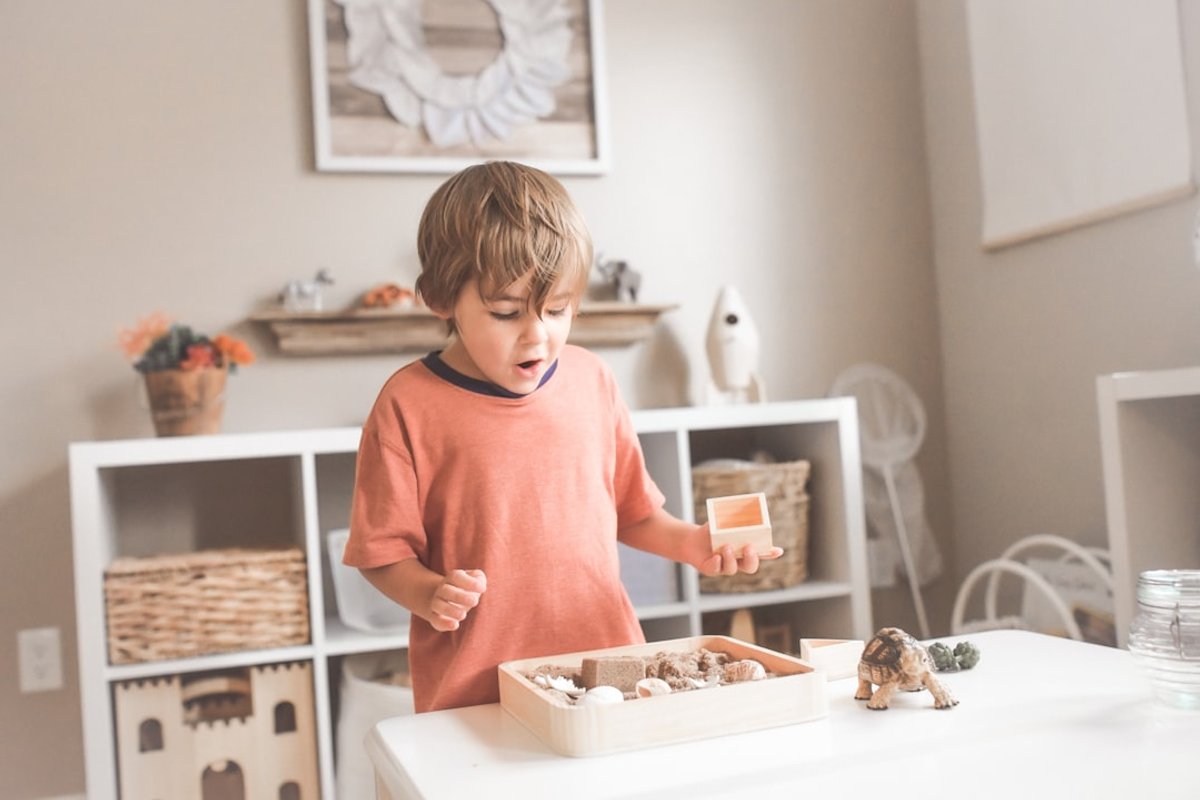 Child developing fine motor skills through play-based activities during dyspraxia occupational therapy session