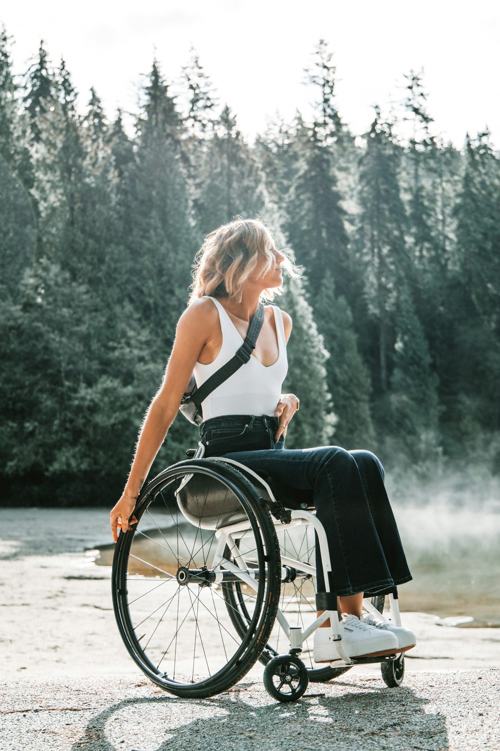 Woman in a manual wheelchair after a mobility equipment assessment