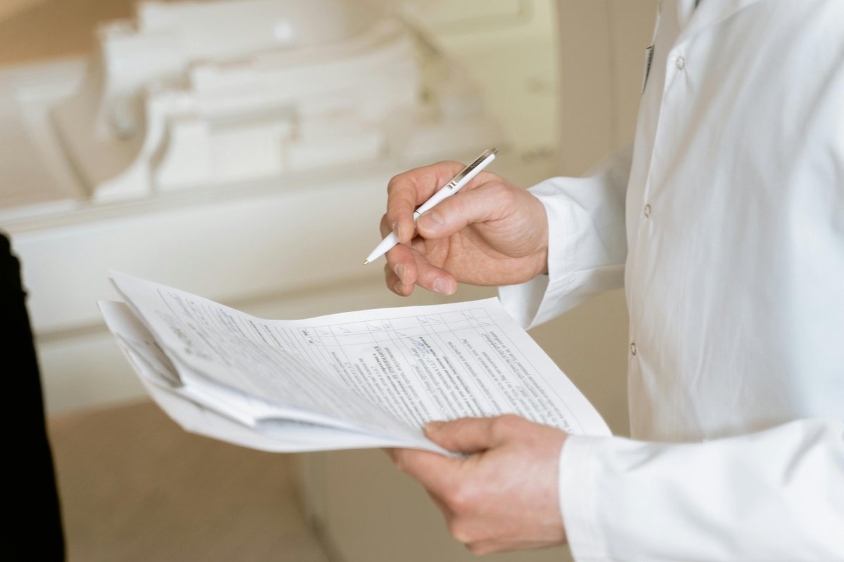 Healthcare professional reviewing NDIS funding documentation for occupational therapy services