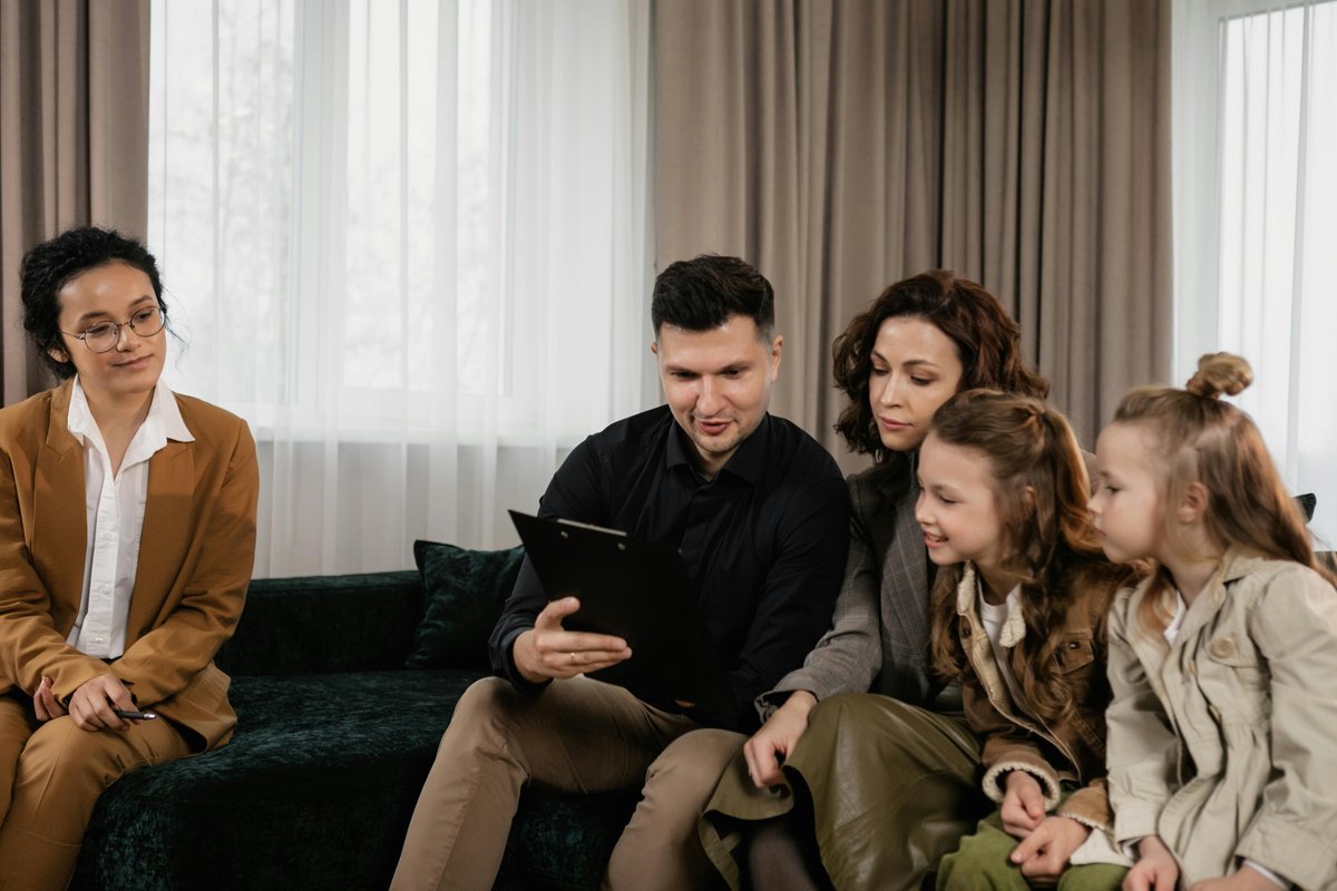 Family receiving NDIS funding advice from professional advisor to plan speech pathology services