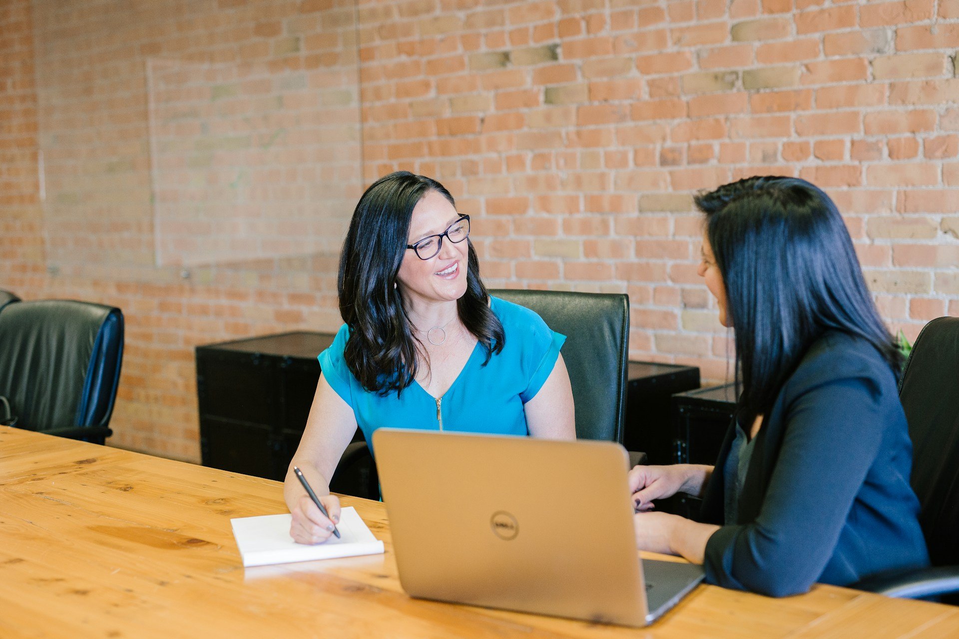 A participant talking with a support person during an NDIS plan reassessment