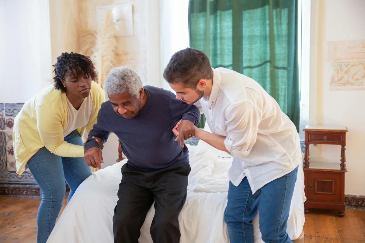 Occupational therapist conducting a home assessment with an elderly client in their living room