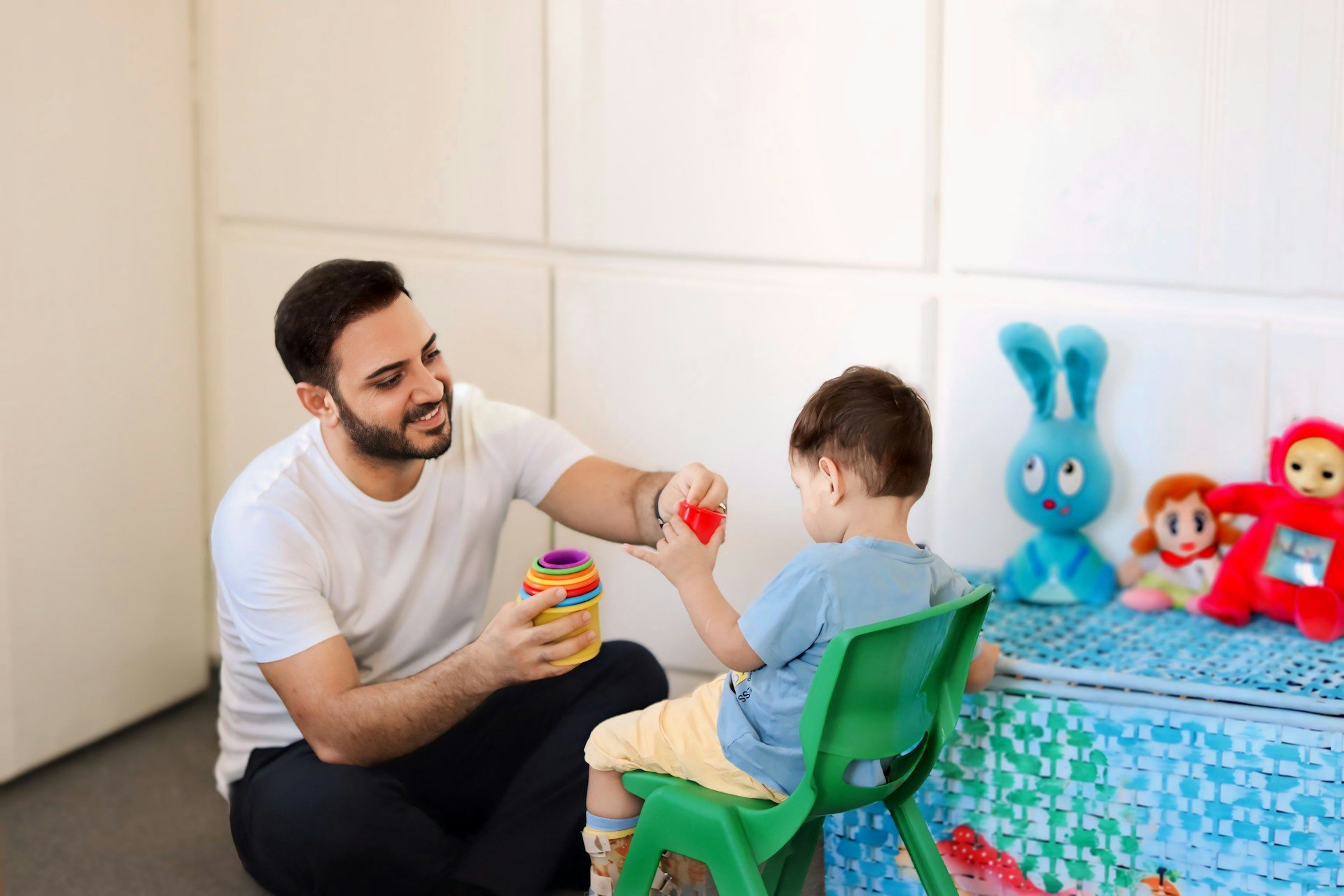 Therapist using play to support communication in a paediatric speech therapy session