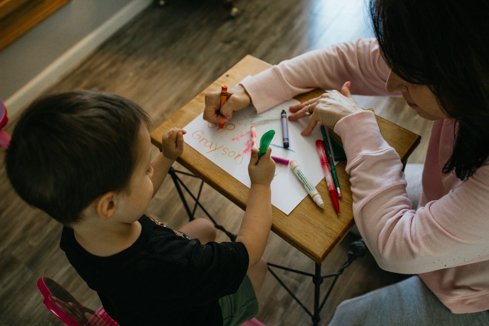 Paediatric speech therapy activity on the Gold Coast with a child colouring and naming at a table